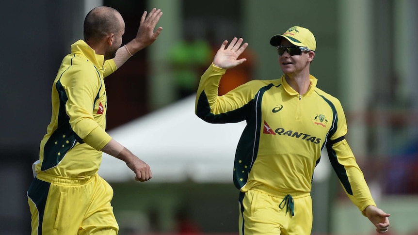 Steve Smith congratulates Nathan Lyon