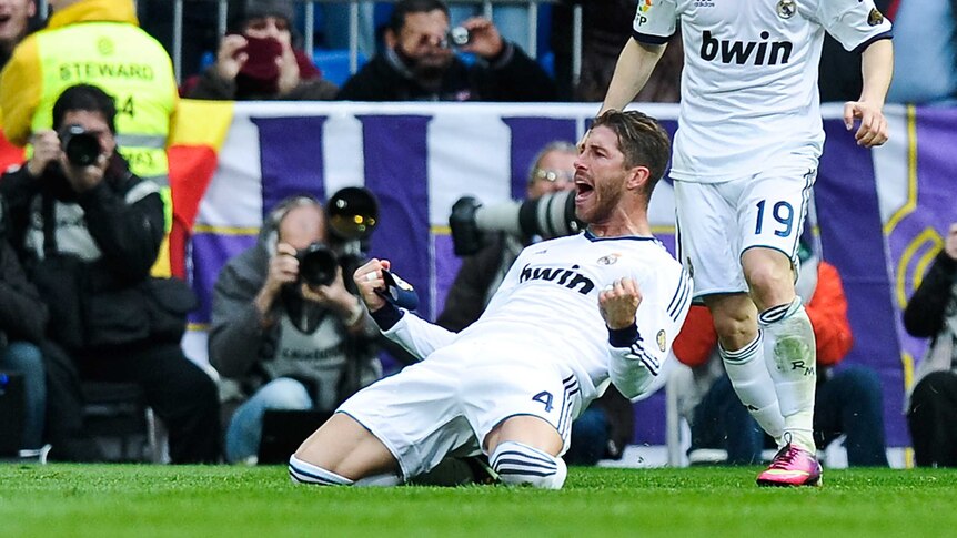 Sergio Ramos (L) headed Real Madrid to a 2-1 win in the El Clasico derby.