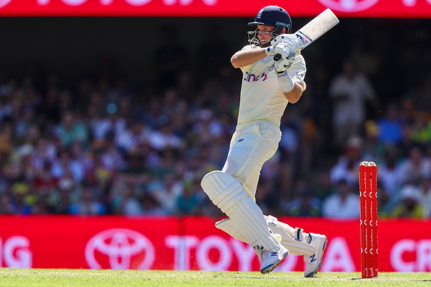 England batter Joe Root completes a pull shot in the first Ashes Test at the Gabba.