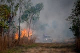 firefighters tackle a bushfire in the nt