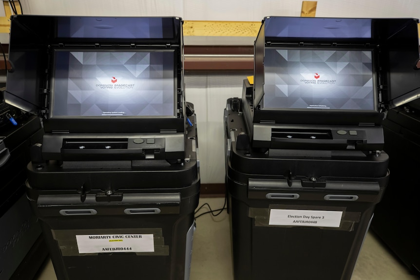 Two machines with screens on the top that say Dominion Imagecast