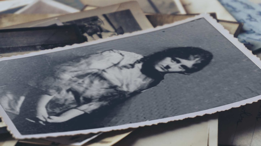 Black and white portrait of a young woman in a story about forced adoption.