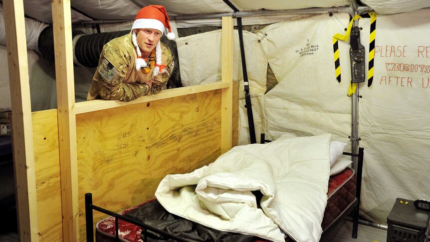 Prince Harry wears a Santa Claus hat in the VHR tent at Camp Bastion, southern Afghanistan.