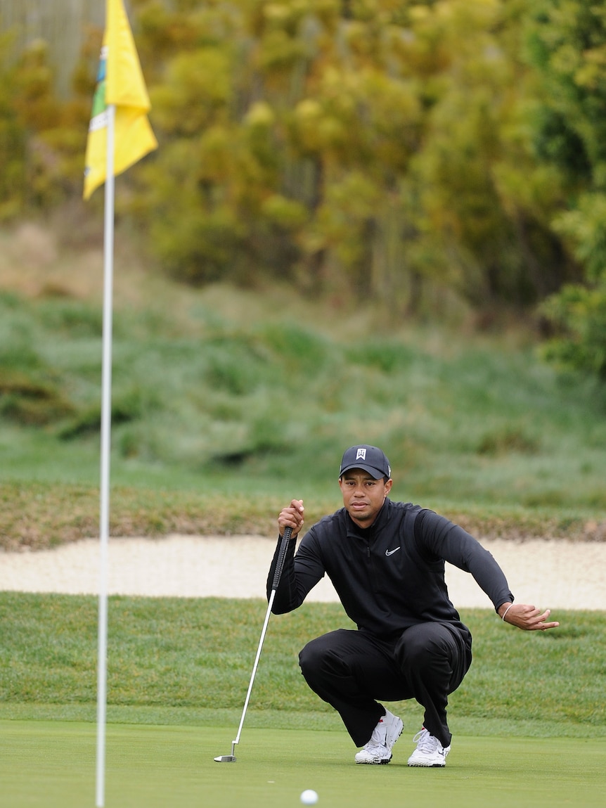 Crouching Tiger ... Woods is four shots off the lead with only two others in front of him.