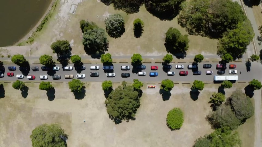 Aerial view of cars queued on road