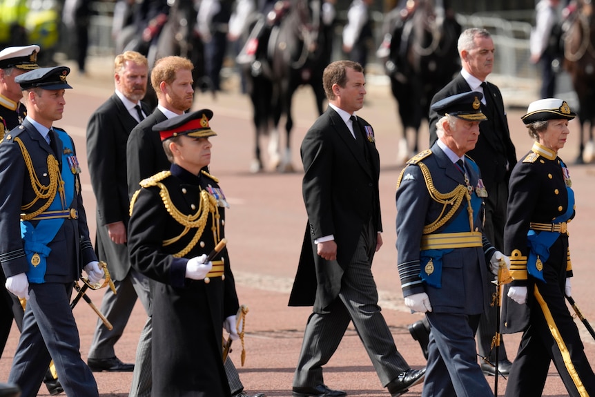 The procession, including King Charles III walking down The Mall. 
