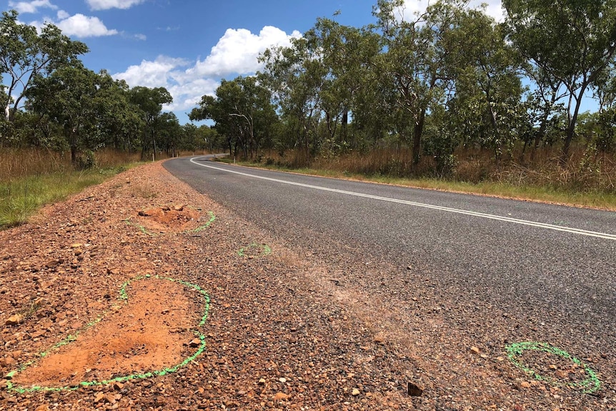 Green markings on the road where Major Crash Investigators examined the site of a fatal accident