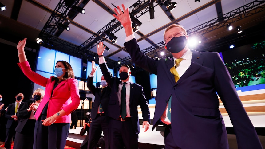 Queensland Premier Annastacia Palaszczuk, Brisbane Mayor Adrian Schrinner and AOC's John Coates wave at the 2032 Olympic vote.