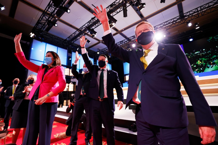 Queensland Premier Annastacia Palaszczuk, Brisbane Mayor Adrian Schrinner and AOC's John Coates wave at the 2032 Olympic vote.