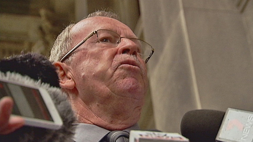 Geoff Brock with reporters