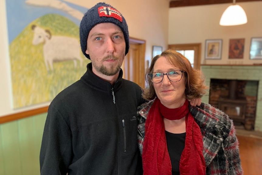 Josh Gatehouse and his mother Margaret standing in a hallway arm in arm