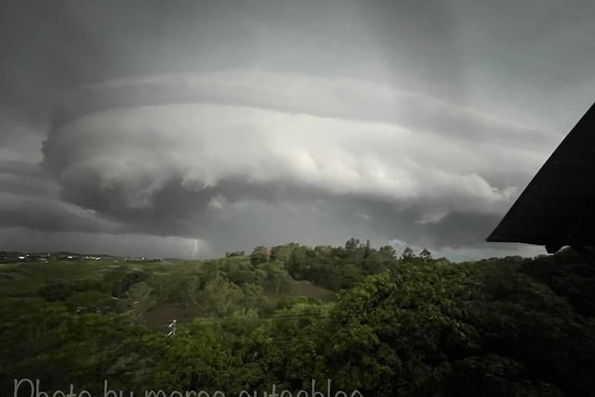 A large cloud formation over an urban area.