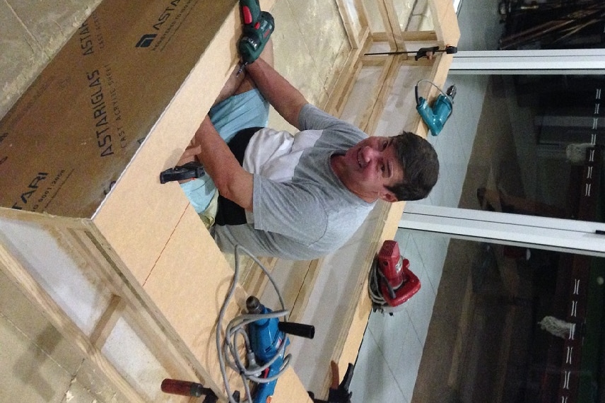 Scott Millar's dad Glenn helps build a two-metre hologram frame at their home in Brisbane's Bayside.