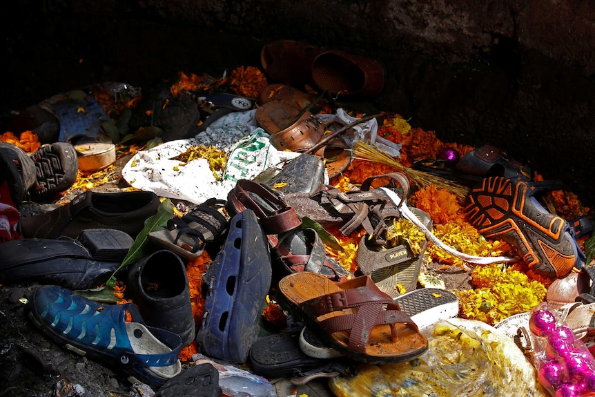 Footwear of the victims are seen under the station's pedestrian overbridge.