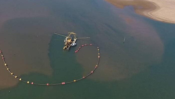 Aerial shot of a dredge working on the silt-choked waterway at Carnarvon