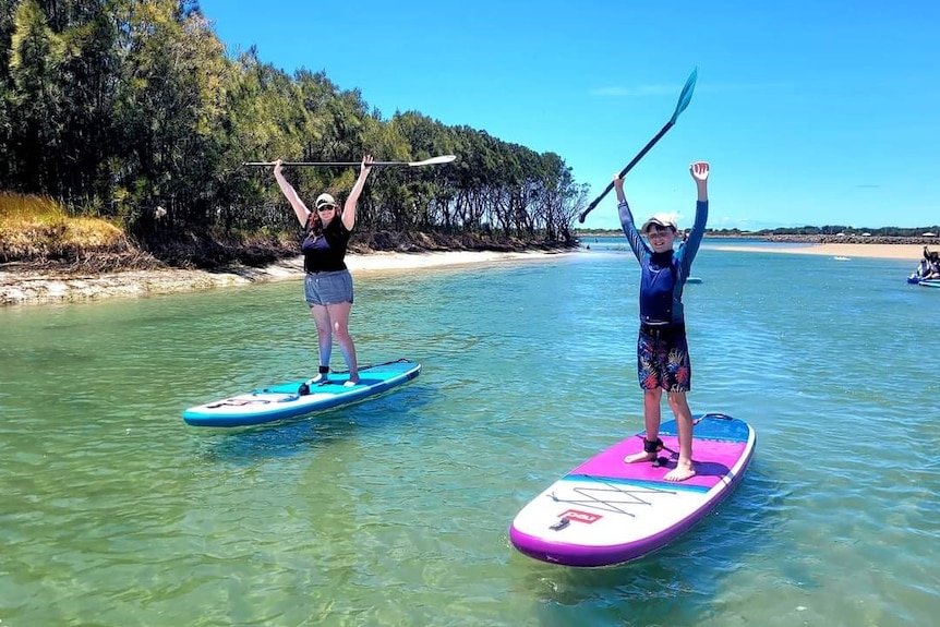 Two people on paddleboards