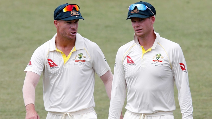 David Warner and Steve Smith leave the pitch after Australia beats South Africa in Durban.