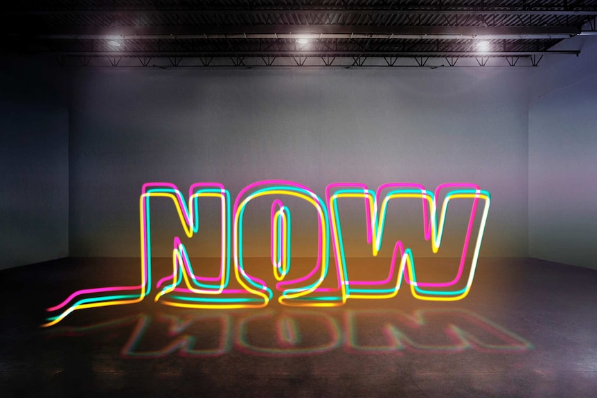 The word 'now' in neon lights