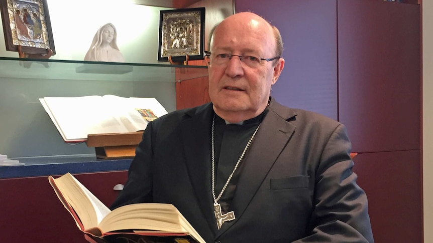 Tasmanian Catholic Archbishop Julian Porteous sits in his office.