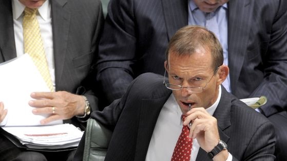 Opposition Leader Tony Abbott listens to Prime Minister Kevin Rudd