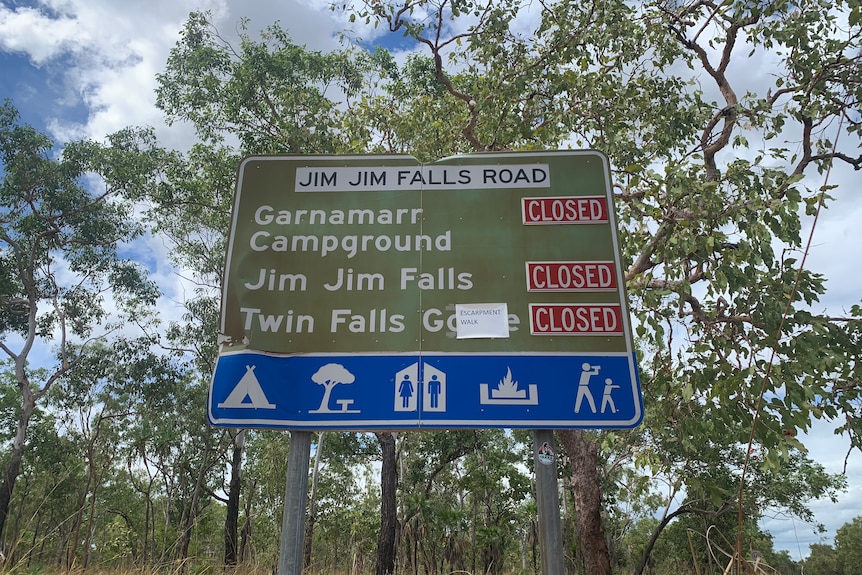 A road sign with Kakadu destinations showing closed roads.