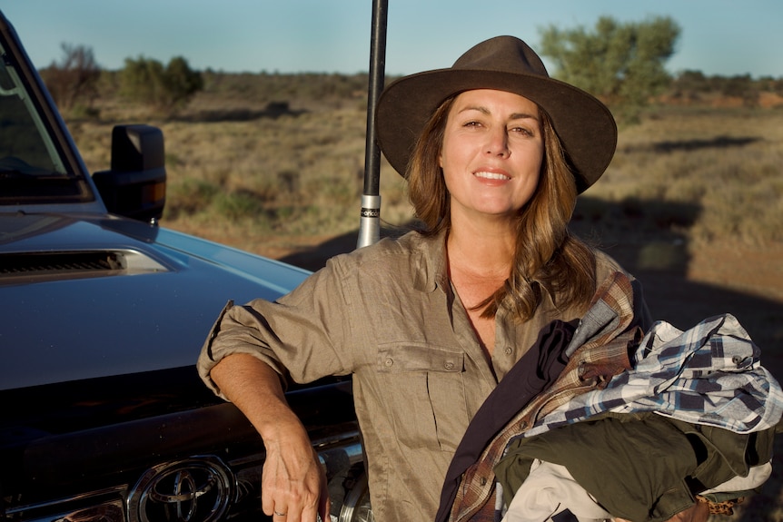 Tanya Egerton NT rural womens award pictured leaning on the front of her truck.