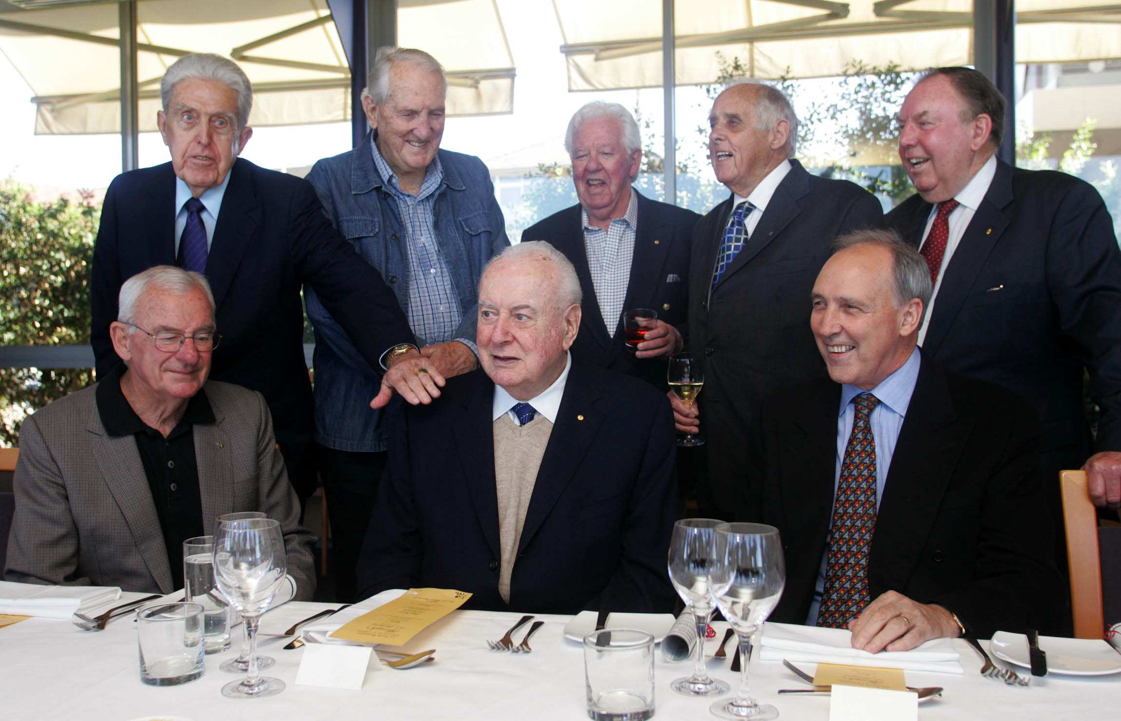Former Labor leader Gough Whitlam (centre) poses for a photo with eight former members of his cabinet.