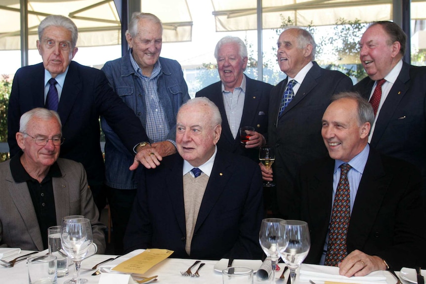 Former Labor leader Gough Whitlam (centre) poses for a photo with eight former members of his cabinet.
