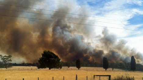 Smoke from the  Symmons Plains fire caused concern for drivers on the Midland Highway.