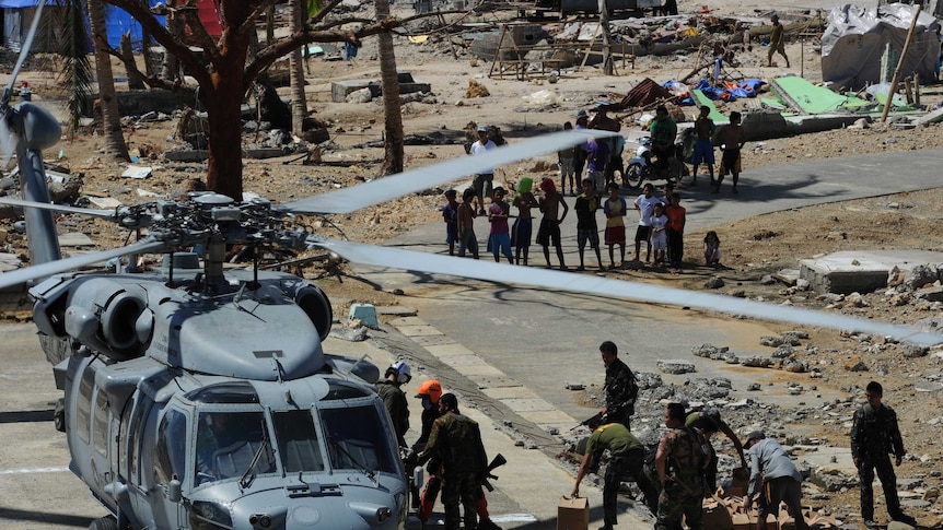 Helicopters drop emergency supplies to desperate villagers in Philippines