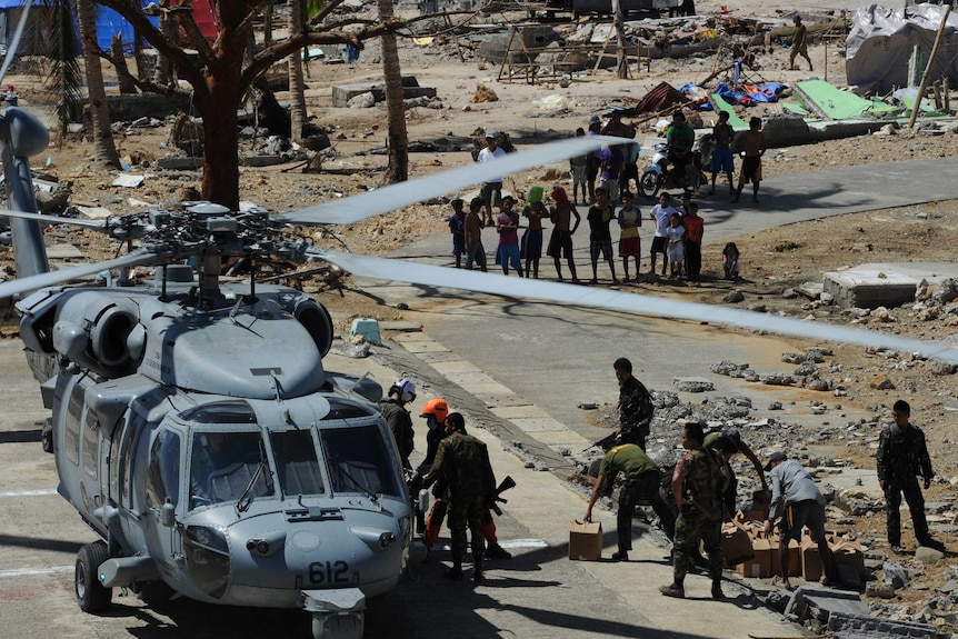 Helicopters drop emergency supplies to desperate villagers in Philippines