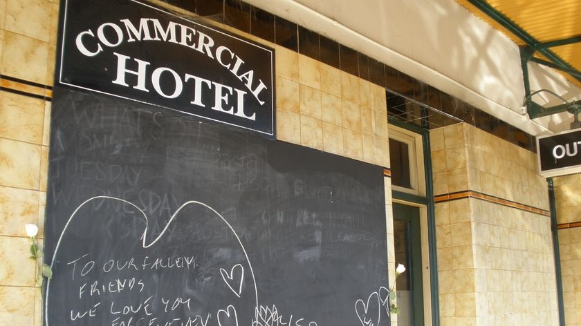 Chalkboard tribute at Balmain's Commercial Hotel, where two of the victims had worked.