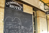 Chalkboard tribute at Balmain's Commercial Hotel, where two of the victims had worked.