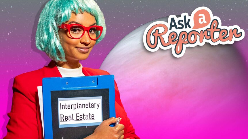 Amelia dressed in bright business suit and silver wig holding a clipboard saying 'Interplanetary Real Estate'.