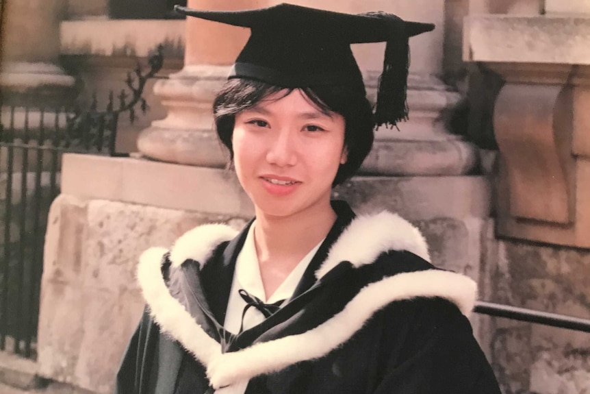 Rowena Chiu wears a graduation cap and cape.