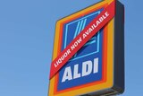 Aldi sign with "liquor now available" on it