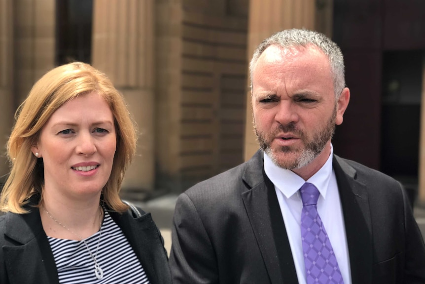 A couple dressed for court.