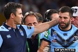 James Tedesco is patted on the back of the head by Brad Fittler