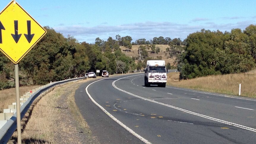 Yellow markings on Tasmania's Midland Highway where DPP Tim Ellis was injured in a fatal crash.