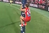 Dane Rampe climbs the goal post, Jake Stringer points his finger and yells at him