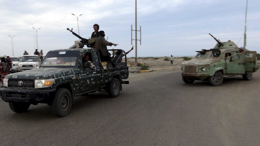 Militants patrol in the southern port city of Aden
