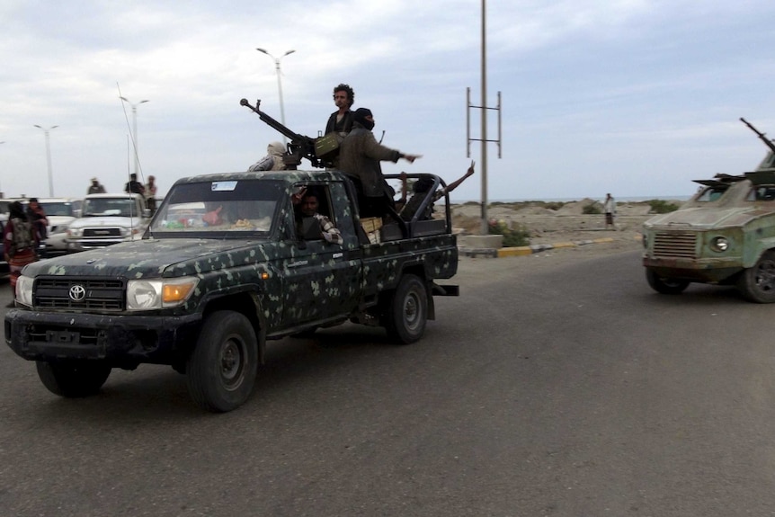 Militants patrol in the southern port city of Aden