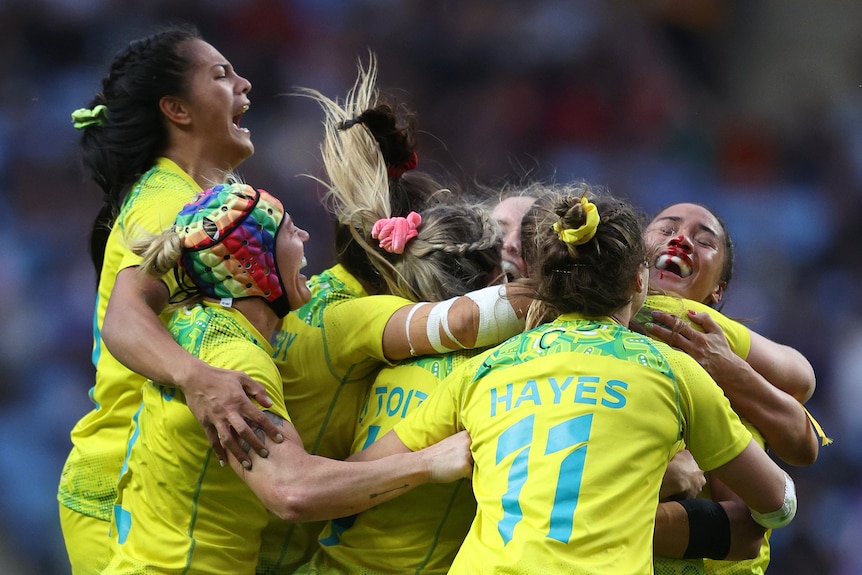 Australian women's rugby players celebrate