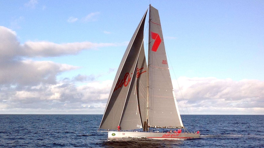 Sydney to Hobart yacht, Wild Oats XI, races down the coast of south east Australia in 2013.