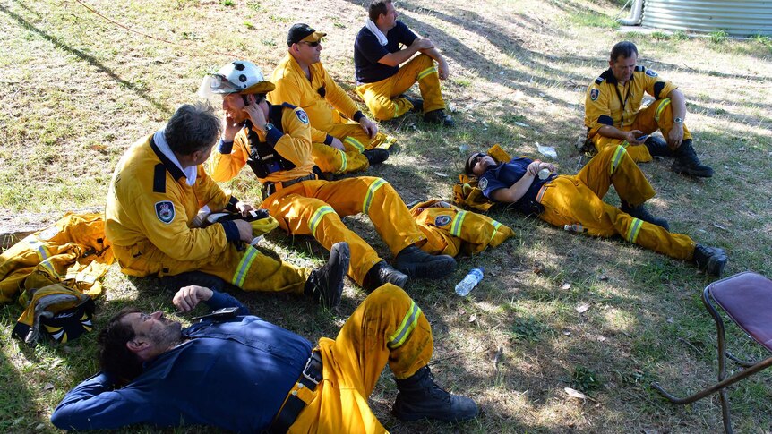 NSW rural firefighters take a break after back-burning near Mount Victoria.