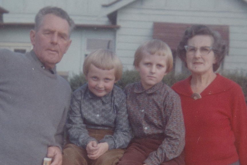 Lyn and Doug Williams with two grandchildren.jpg