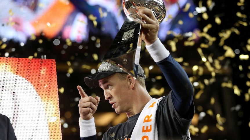 Peyton Manning holds Super Bowl trophy