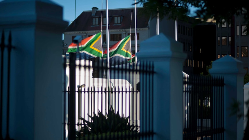South African flags fly at half-mast