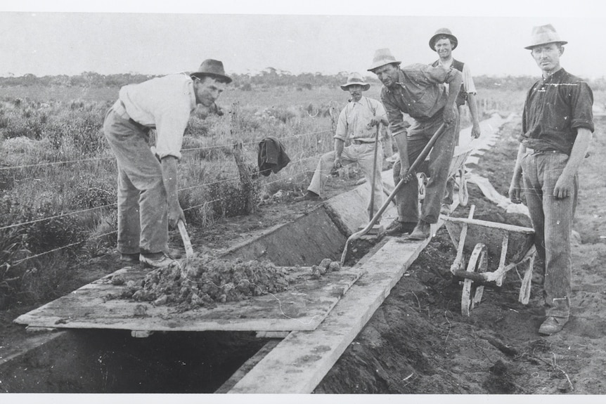 Men digging and irrigation channel