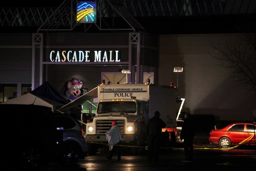 A police truck stands outside the Cascade Mall in Burlington where a shooting took place.
